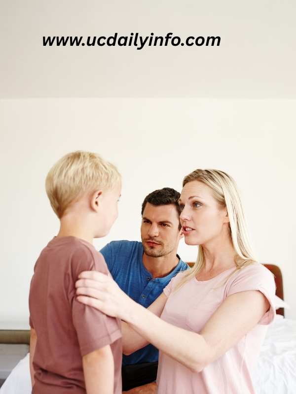 parents-holding-their child-shoulder-giving him-parenting-advice for-raising-confident-kids
