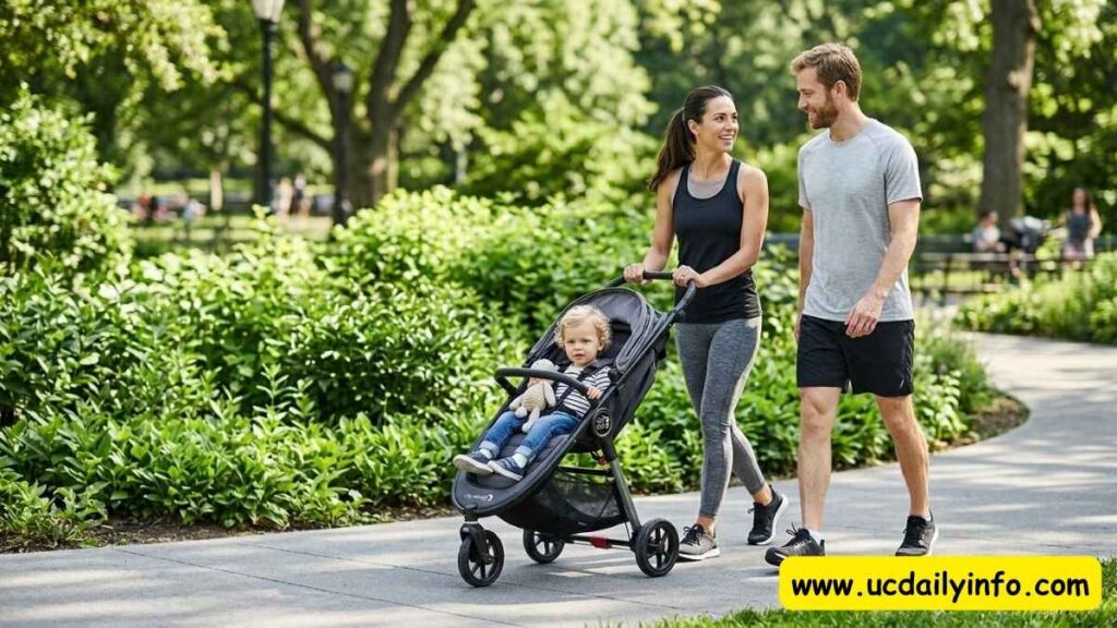 Mom pushing one of the best baby strollers for newborns along a paved park path