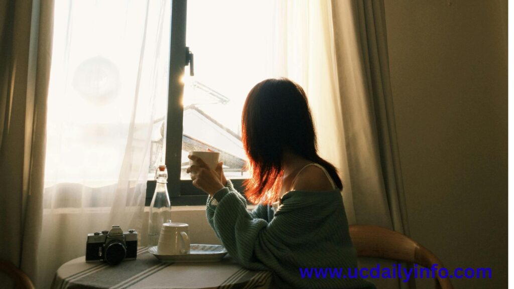 Visual Idea: A peaceful morning scene of a parent sitting by a window with a cup of tea while the sun rises.