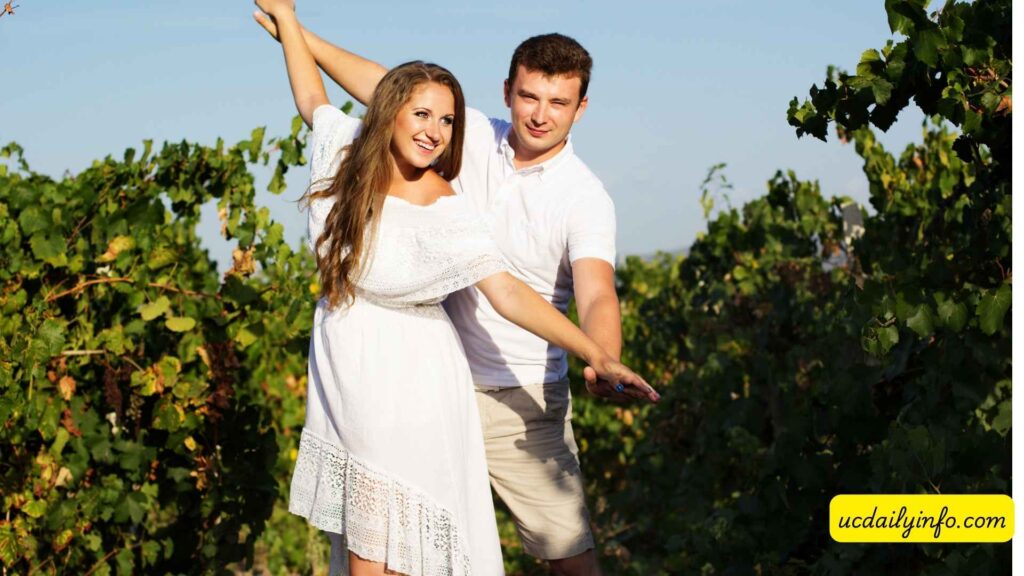 Couple-walking-through-a-scenic-vineyard