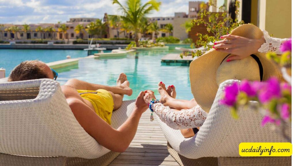 Couple-relaxing-beside-an-oceanfront-resort-pool