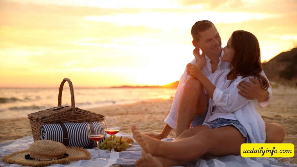 Couple-enjoying-a-romantic-sunset-picnic-on-the-beach